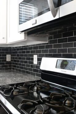 gray granite countertop white cabinet black slate mosaic tile BA1070