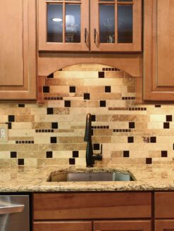 Brown cabinets quartz countertop travertine backsplash tile BA1025