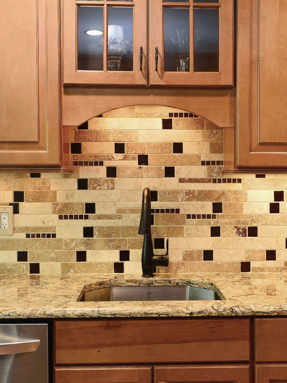 Brown cabinets quartz countertop travertine backsplash tile BA1025