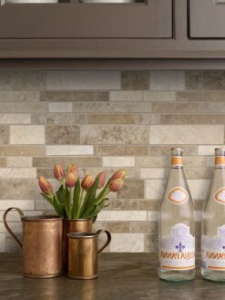 black countertop travertine brown backsplash tile brown cabinets