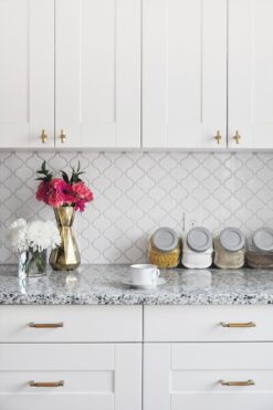 White polish glazed porcelain arabesque 11 in x 9.7 in wall Tile. Mesh-Mounted makes installation a much easier process. This glossy porcalein created antique pattern for install project for bathrooms and kitchens.