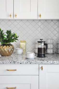 White polish glazed porcelain arabesque 11 in x 9.7 in wall Tile. Mesh-Mounted makes installation a much easier process. This glossy porcalein created antique pattern for install project for bathrooms and kitchens.