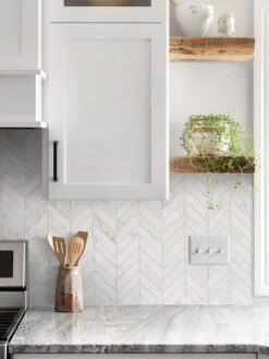 gray granite countertop with cabinets and white marble chevron backsplash tile BA631613