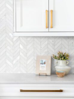 white marble countertop kitchen cabinets with white chevron marble tile BA631613