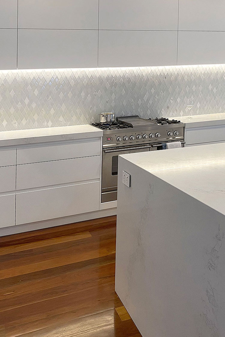 modern white kitchen white backsplash