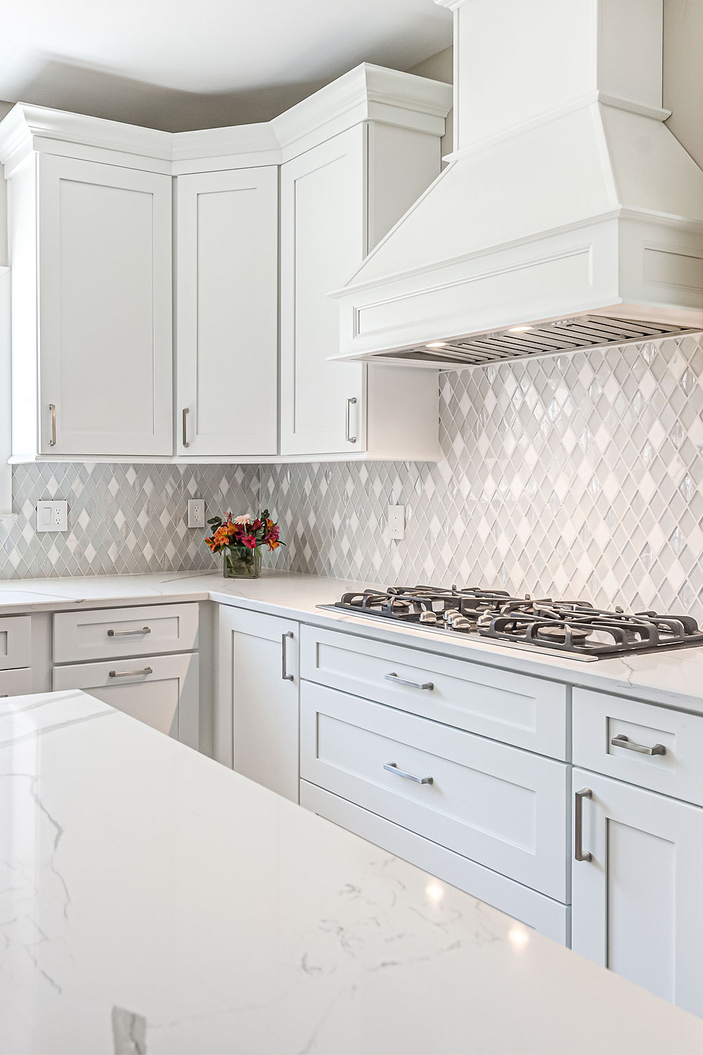 white quartz countertop white cabinet backsplash