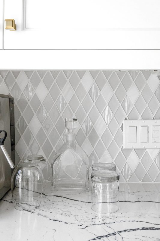 White Countertop With Dark Veins Glass And Marble Backsplash Tile BA62046