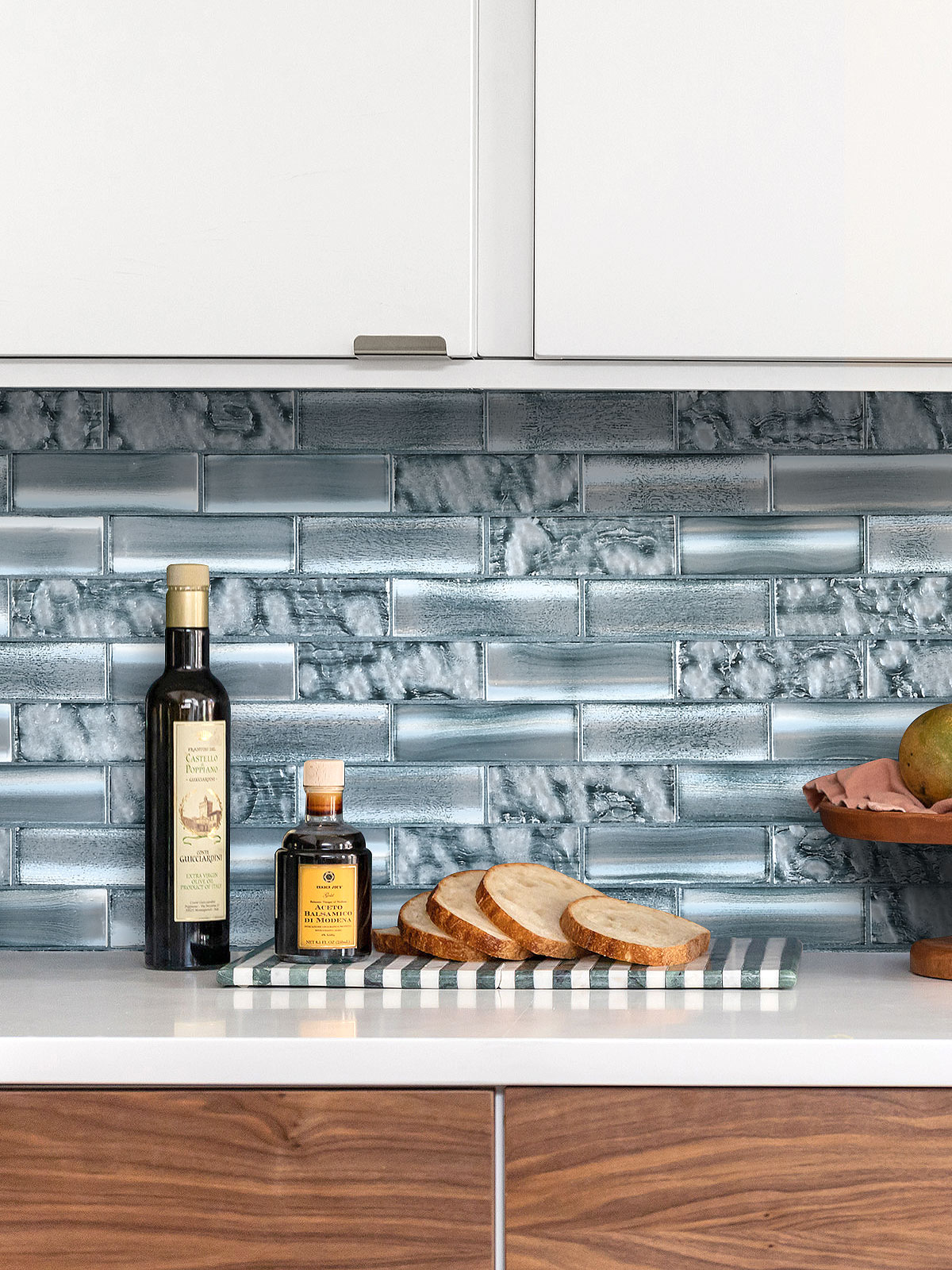 Brown Cabinets With Space Blue Subway Glass Backsplash Tile