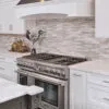 white modern kitchen with marble subway tile 1