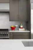 Contemporary Kitchen Brown Cabnets White Quartz Countertop