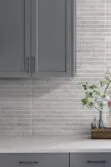 Modern Gray Kitchen Quartz Countertop With Gray Backsplash