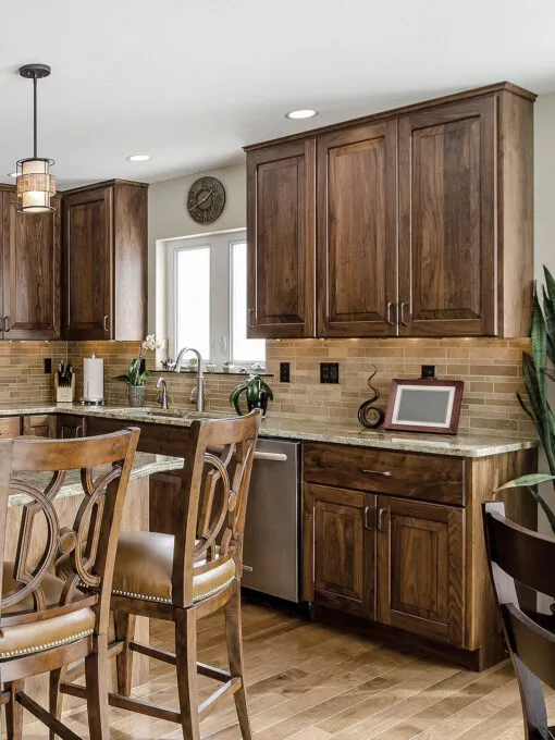 travertine backsplash tile brown cabinets floor granite countertop
