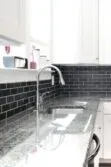 white cabinet new caledonia granite countertop slate subway bacskplash tile BA1070