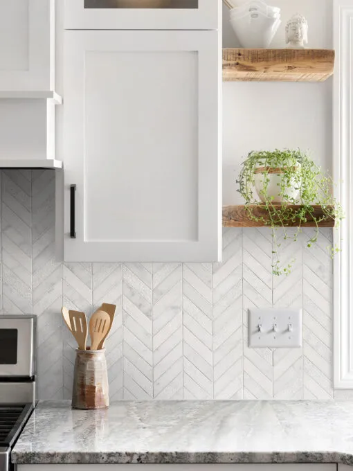 gray granite countertop with cabinets and white marble chevron backsplash tile BA631613