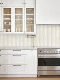 Modern Beige Backsplash Tile with White Kitchen Cabinets